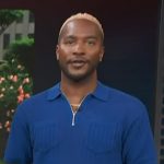 Scott’s blue knit polo shirt on Access Hollywood