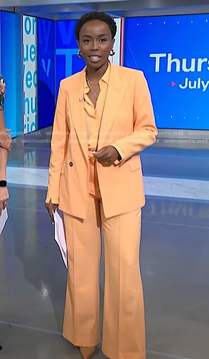 Zinhle's orange blazer and wide leg pants on NBC News Daily