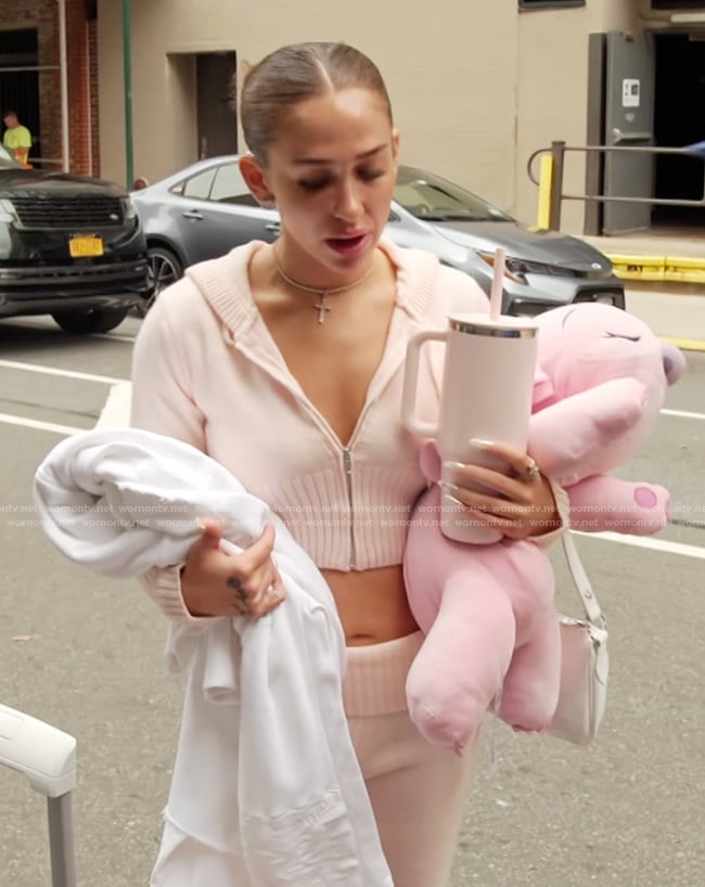 Ariana’s pink cropped hoodie on Next Gen NYC
