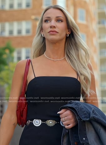 Calah's black mini dress and red shoulder bag on The McBee Dynasty Real American Cowboys
