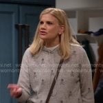 Carol’s grey skull and crossbones hoodie sweater on Leanne