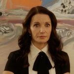 Charlotte’s black two-tone tie neck blouse on And Just Like That