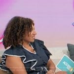 Damona Hoffman’s navy ruffle dress on Access Hollywood