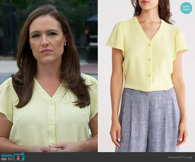 DKNY V-Neck Button-Up Top in Light Lemon worn by Nikki Battiste on CBS Mornings