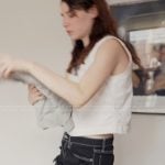 Georgia’s black denim distressed shorts on Next Gen NYC