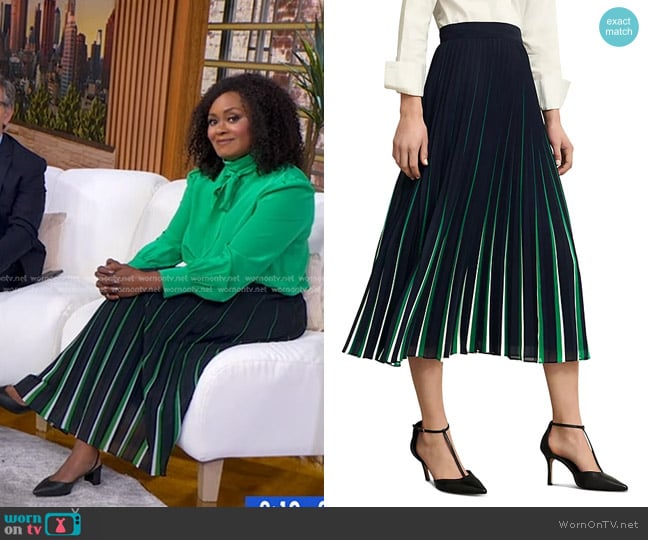Ericka Sóuter’s navy stripe pleated skirt on GMA