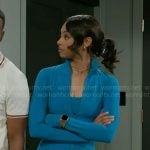 Kat’s teal blue workout jacket and leggings set on Beyond the Gates
