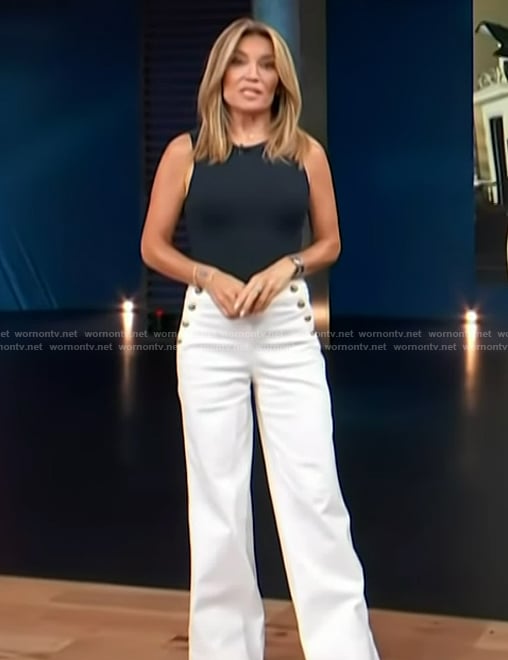 Kit’s white button detail white pants on Access Hollywood