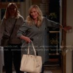 Leanne’s green long shirt and white bag with tassels on Leanne