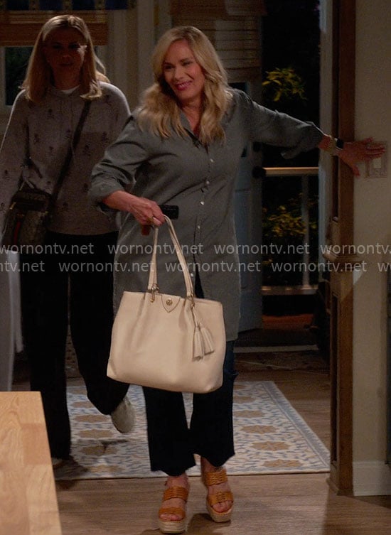 Leanne's green long shirt and white bag with tassels on Leanne
