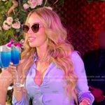 Lisa’s blue logo print shirt and mini skirt on The Real Housewives of Miami