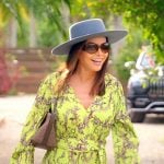 Adriana’s yellow print pleated mini dress on The Real Housewives of Miami