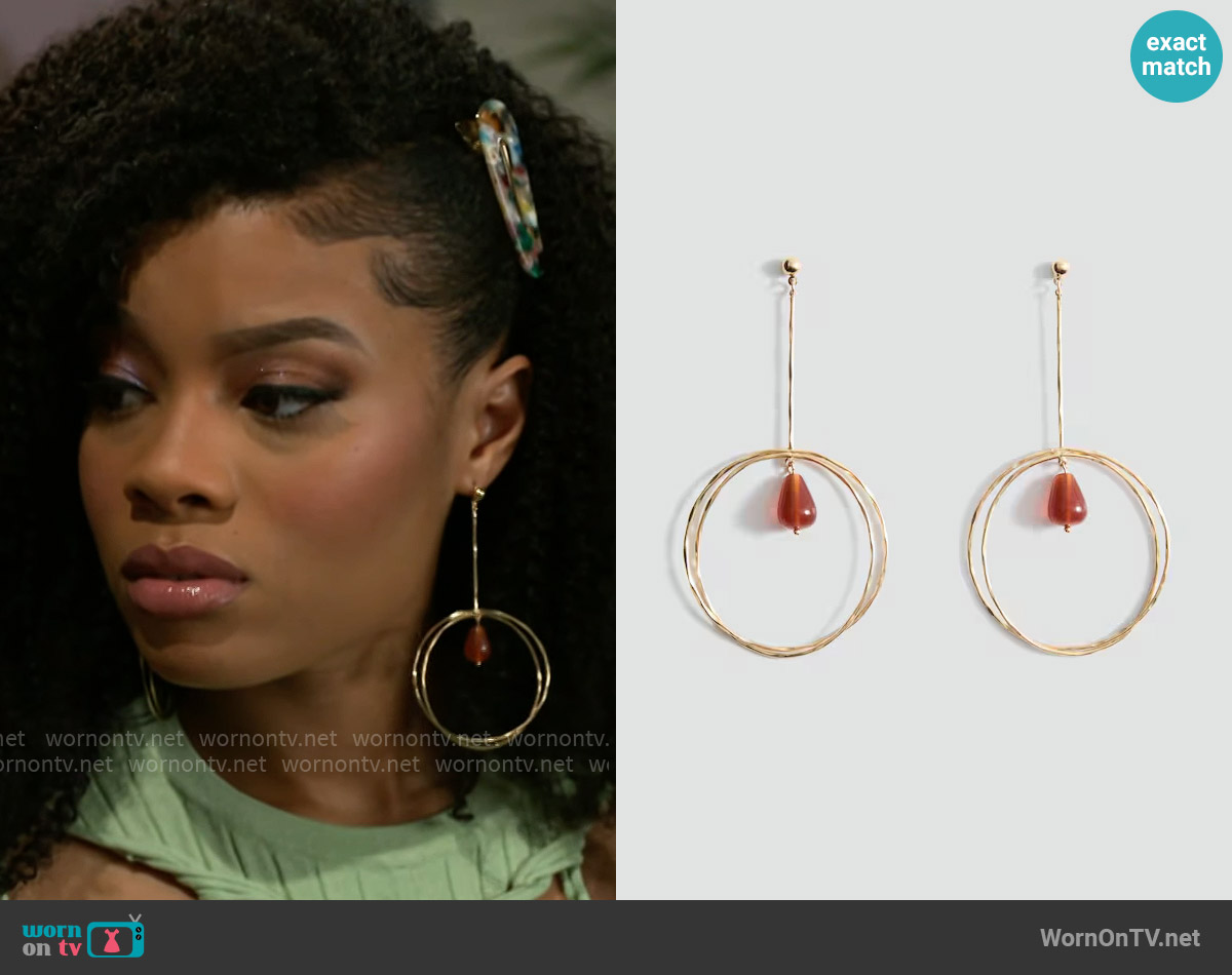 Mango Hanging hoop earrings with ball detail worn by Eva Thomas (Ambyr Michelle) on Beyond the Gates