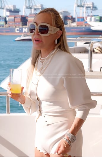 Marysol’s white scalloped cardigan and shorts on The Real Housewives of Miami