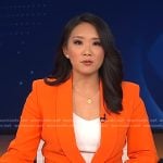 Nancy Chen’s orange blazer and pants on CBS Evening News