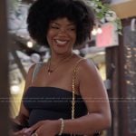 Riley’s black and gold bag on Next Gen NYC
