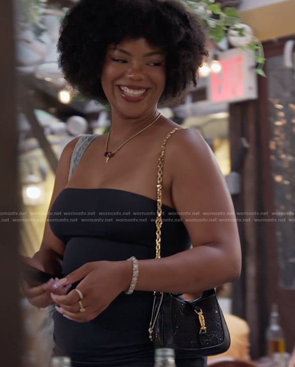 Riley’s black and gold bag on Next Gen NYC