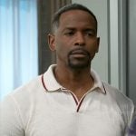 Ted’s white textured polo shirt with red trims on Beyond the Gates