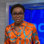 Zinhle’s orange chain print blouse and teal blue pants on NBC News Daily