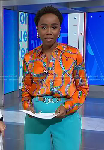 Zinhle's orange chain print blouse and teal blue pants on NBC News Daily