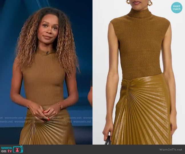 Zuri’s brown ribbed knit top on Access Hollywood