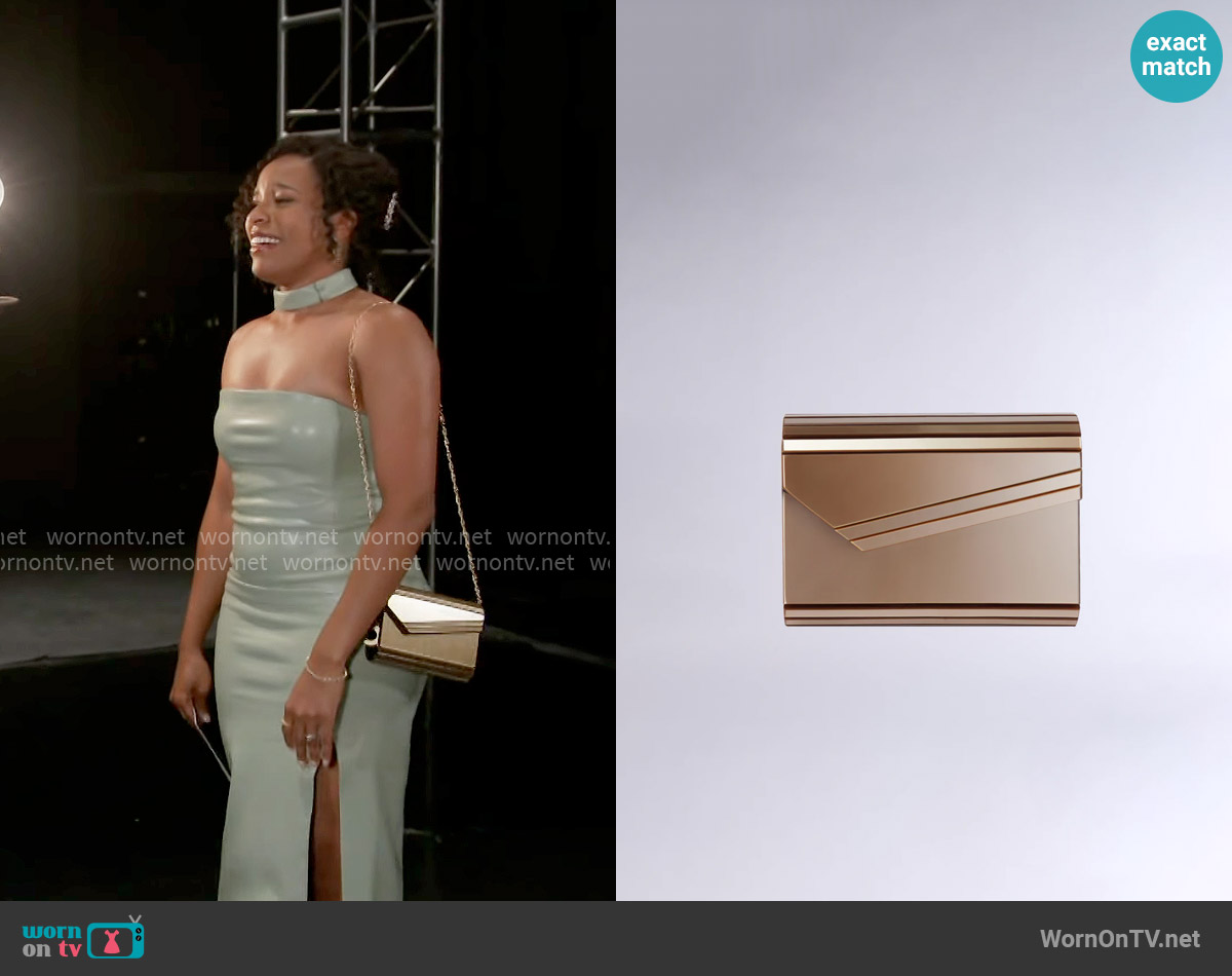 Akira Speed Chase Metallic Clutch worn by Naomi Hamilton Hawthorne (Arielle Prepetit) on Beyond the Gates