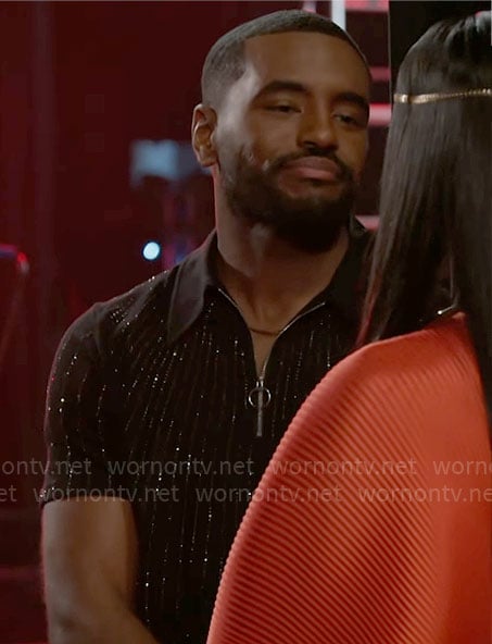 Andre’s black rhinestone studded polo shirt on Beyond the Gates