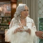Anita’s white sheer jacket with feather cuffs on Beyond the Gates