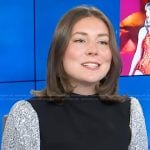 Reagan’s black sequin sleeve sweater on Access Hollywood