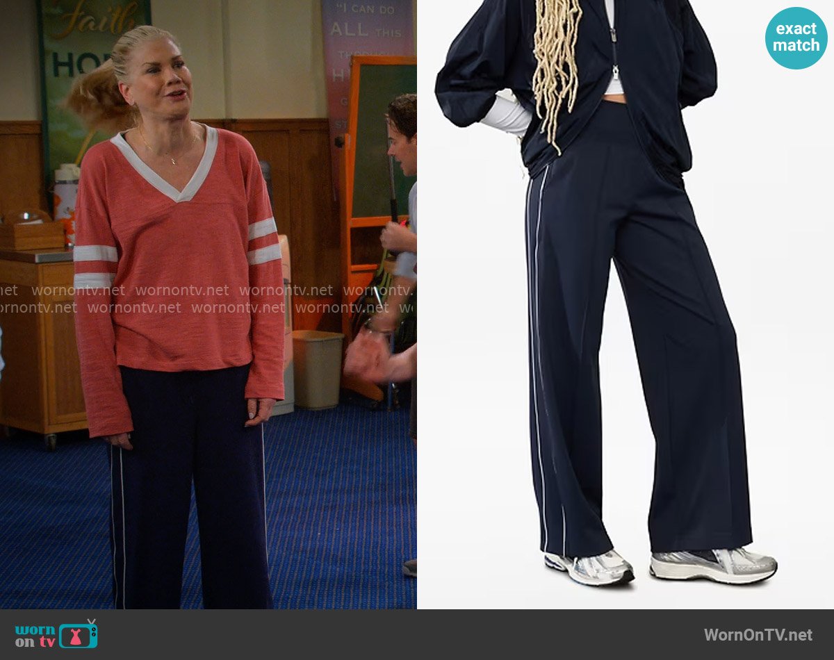 Athleta Venice High Rise Track Stripe Wide Leg Pant in Navy / Bright White worn by Carol (Kristen Johnston) on Leanne
