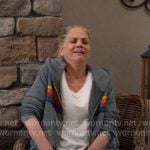 Carol’s grey hoodie with rainbow stripes and navy track pants on Leanne