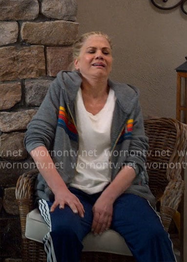 Carol's grey hoodie with rainbow stripes and navy track pants on Leanne