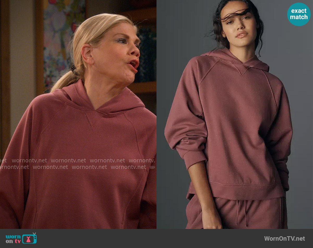 Daily Practice at Anthropologie Sparkle Pullover Hooded Sweater in Pink worn by Carol (Kristen Johnston) on Leanne