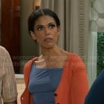 Dani’s blue top and orange cardigan on Beyond the Gates