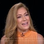 Debra Alfarone’s orange pleated dress on CBS Mornings