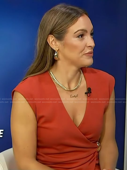 Emily’s red wrap top on Access Hollywood