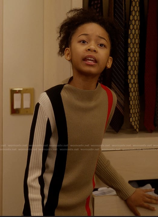 Gabrielle's plaid sweater and mini skirt on And Just Like That