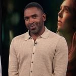 Justin’s beige waffle knit cardigan on E! News