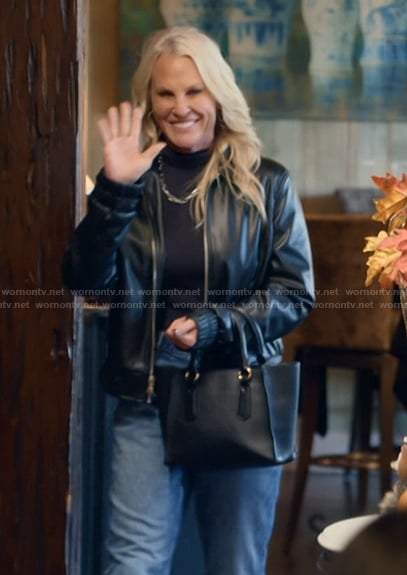 Kristi's black leather bag on The McBee Dynasty Real American Cowboys