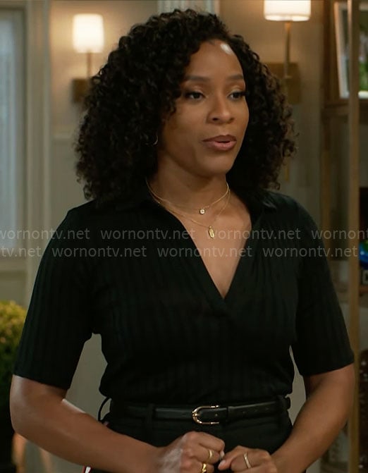 Naomi's black rib knit polo top and side-stripe pants on Beyond the Gates