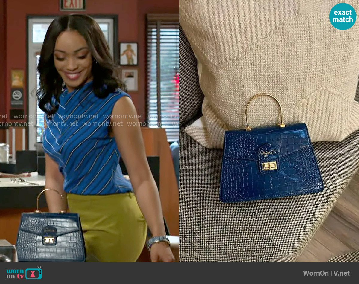 Shydiva Tracee Bag worn by Madison Montgomery (Kenjah) on Beyond the Gates