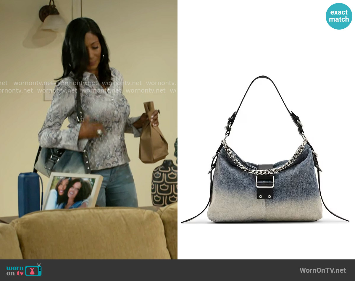 Steve Madden Balyssa Chain Charm Buckled Slouchy Hobo Bag worn by Dana 'Leslie' Thomas (Trisha Mann-Grant) on Beyond the Gates
