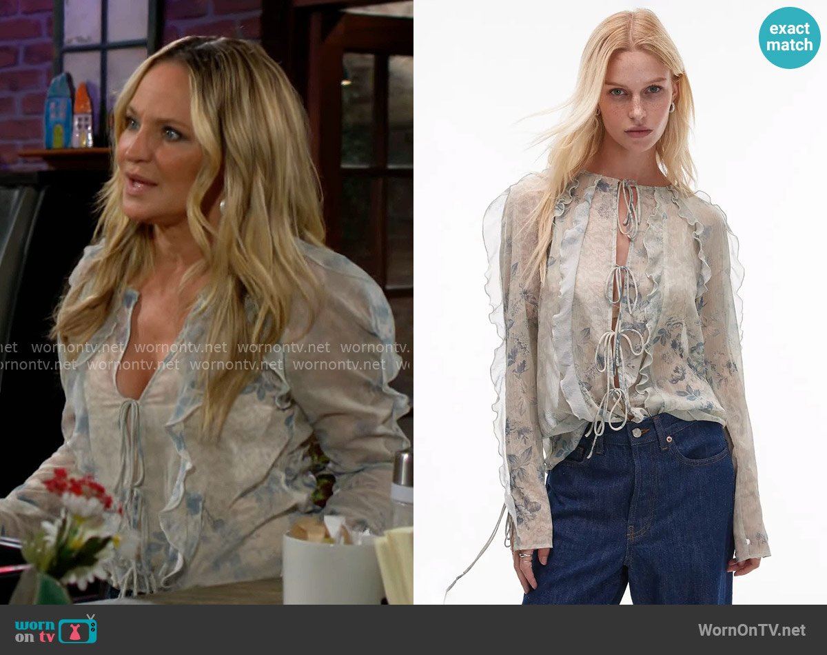 Topshop Ruffle sleeve sheer tie front top in blue lace floral print worn by Sharon Newman (Sharon Case) on The Young and the Restless