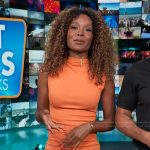 Zuri’s orange ruched side dress on Access Hollywood