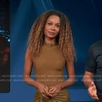 Zuri’s brown ribbed knit top and pleated leather skirt on Access Hollywood