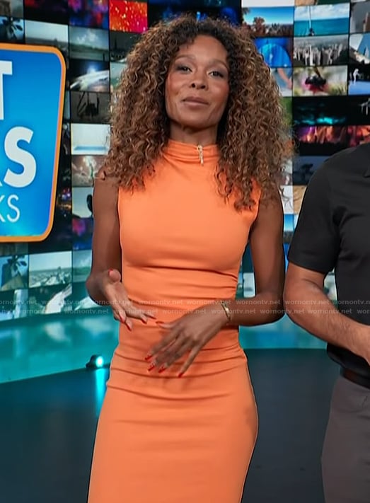 Zuri’s orange ruched side dress on Access Hollywood