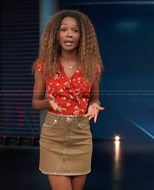 Zuri’s red floral print top and denim mini skirt on Access Hollywood