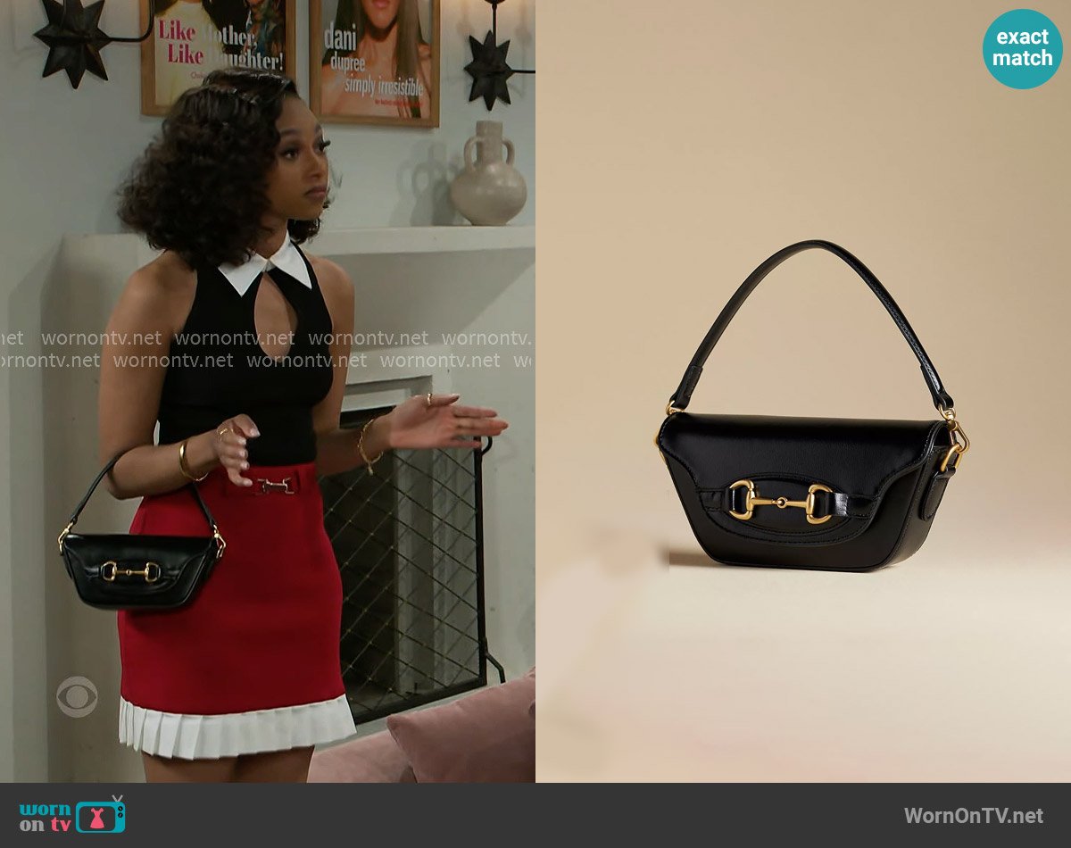 Anthropologie The Delilah Bag Horsebit Edition worn by Kat Richardson (Colby Muhammad) on Beyond the Gates