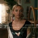 Ava’s black heart graphic top on High Potential