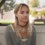Ava’s striped tank top, crochet cardigan and snake print jeans on High Potential